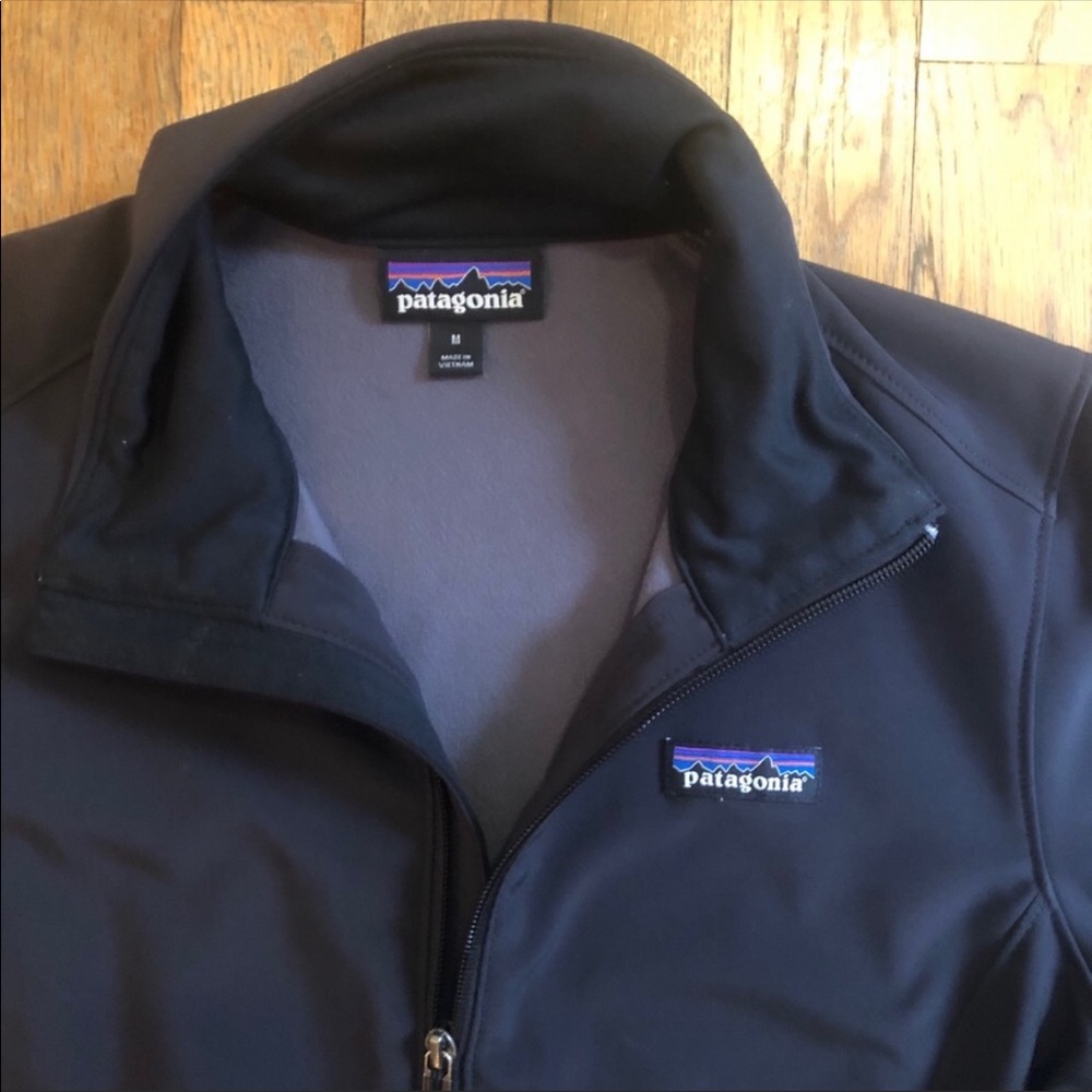 Black Patagonia zip-up jacket.